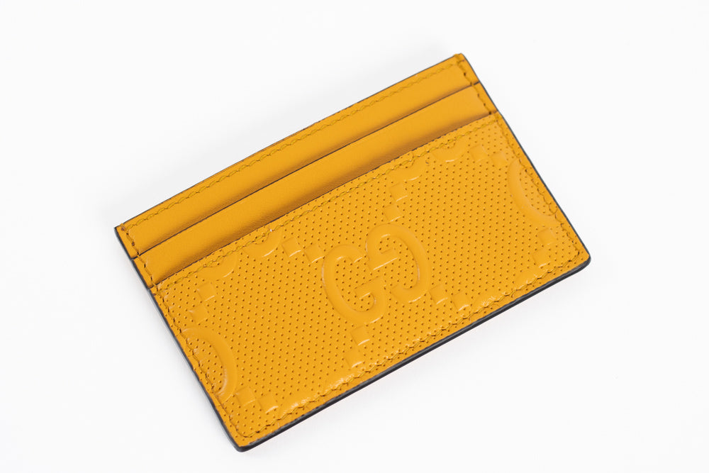 Gucci GG embossed leather card case.