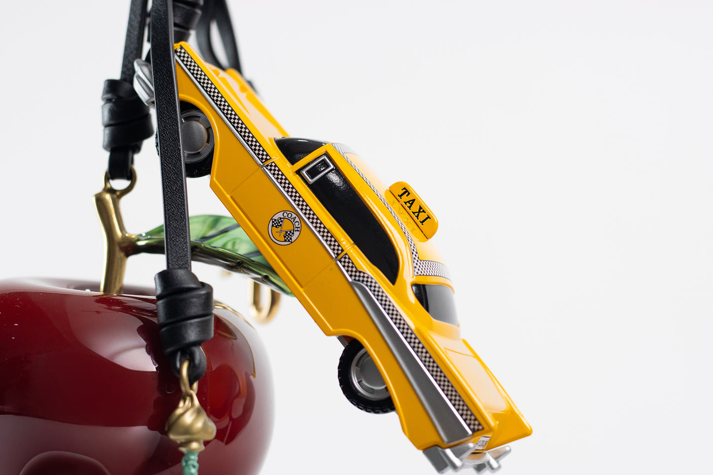 Coach – “Large New York Cluster Bag Charm”