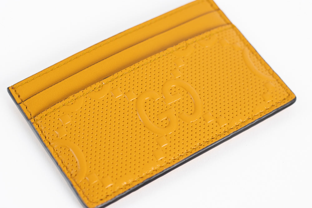 Gucci GG embossed leather card case.