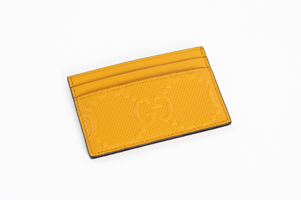 Gucci GG embossed leather card case.